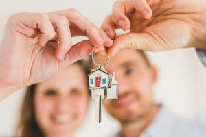 Couple holding house keys